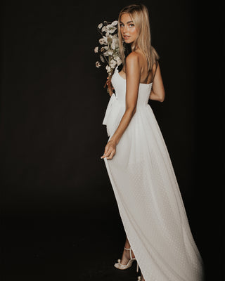 Model wearing Eden Rock dress in Ivory by Katie May